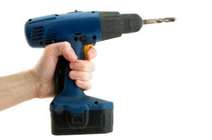 Cordless screwdriver in one hand